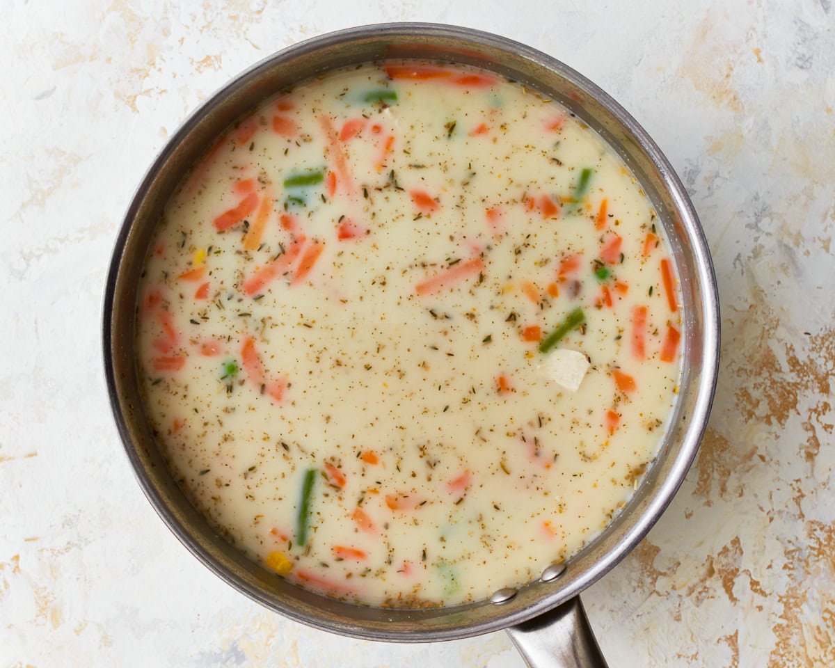 The base for gluten-free chicken and dumplings in a glass mixing bowl