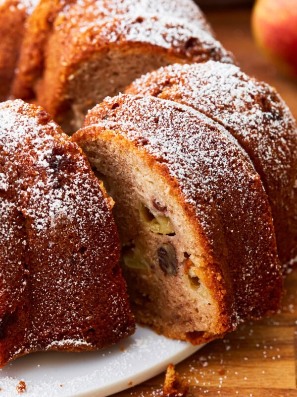 A close up of a sliced gluten-free apple cake.