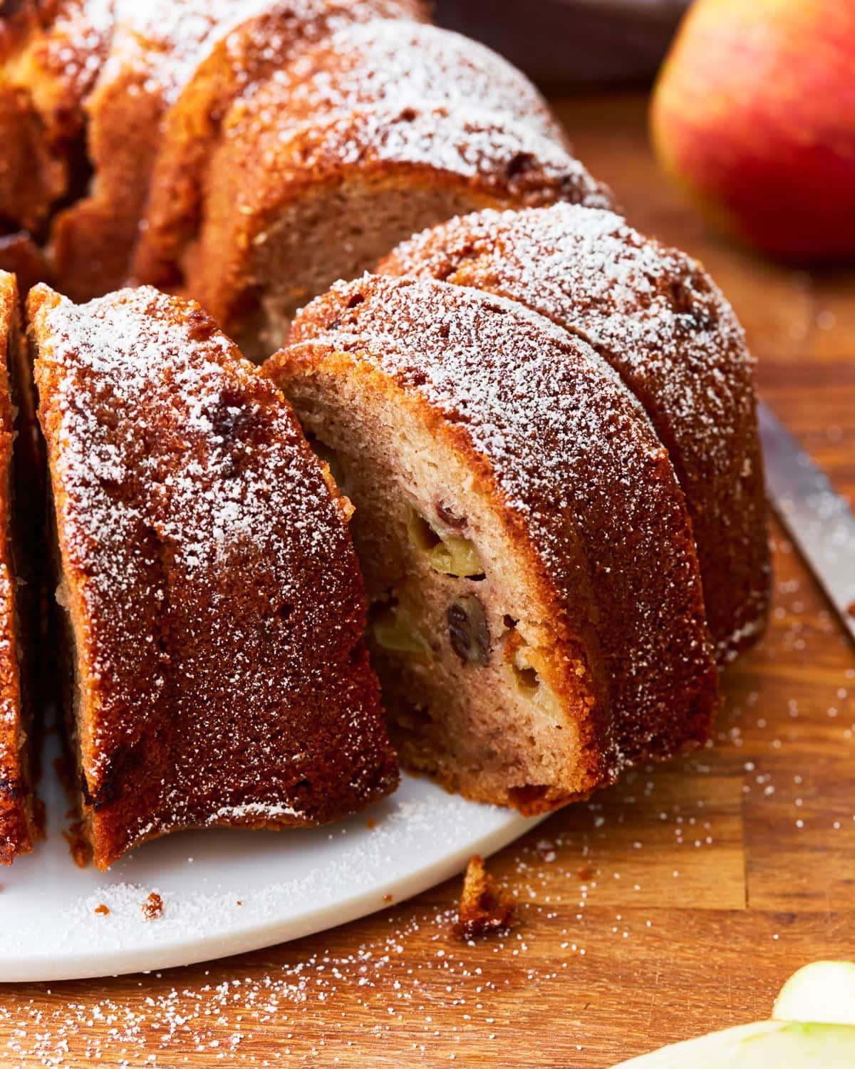 A close up of a sliced gluten-free apple cake.