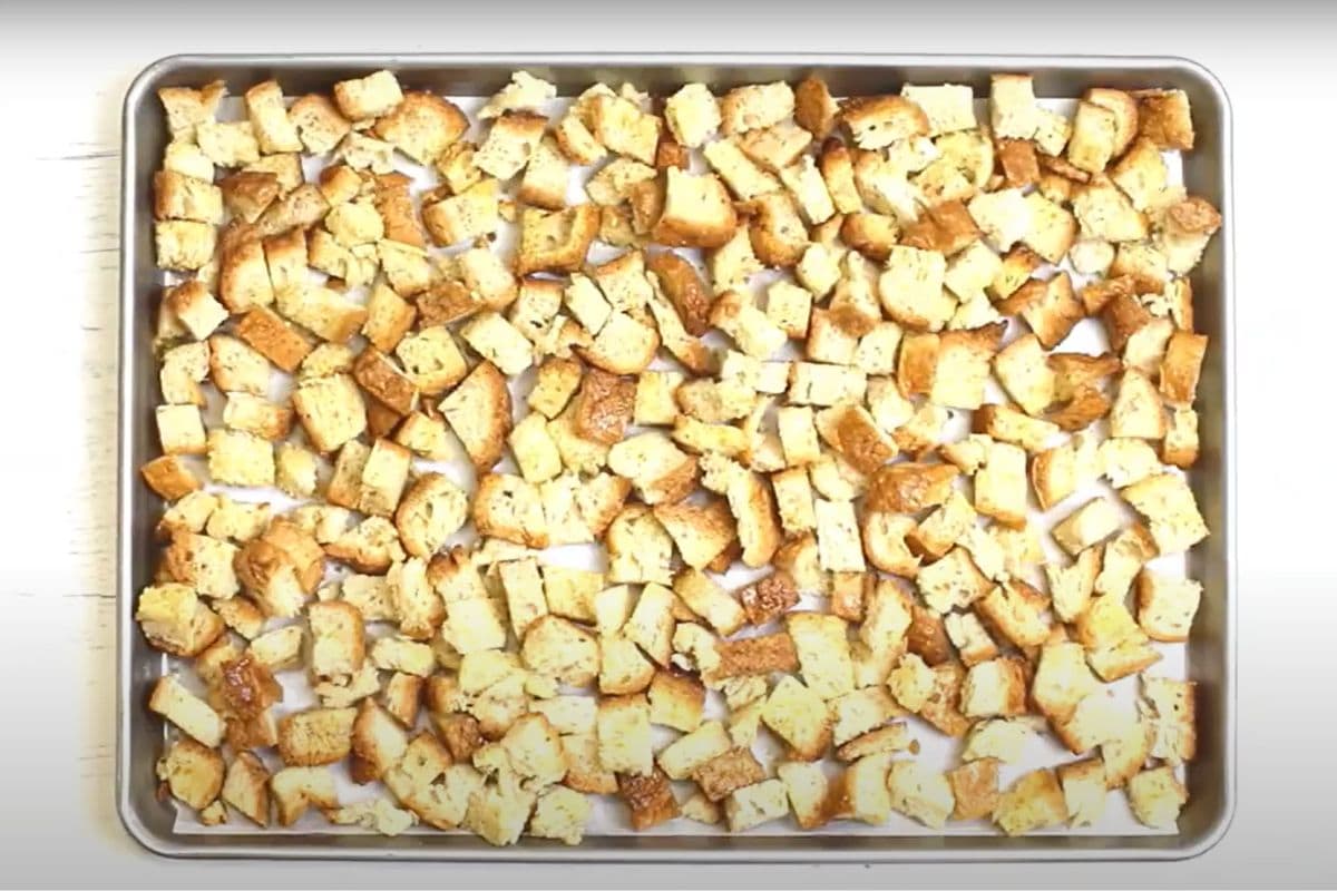 Gluten-free croutons on a baking sheet.