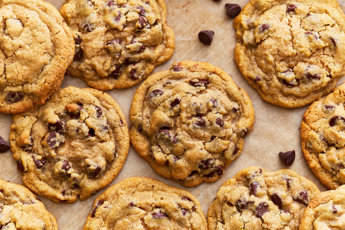 Gluten-free chocolate chip cookies on a parchment lined baking sheet