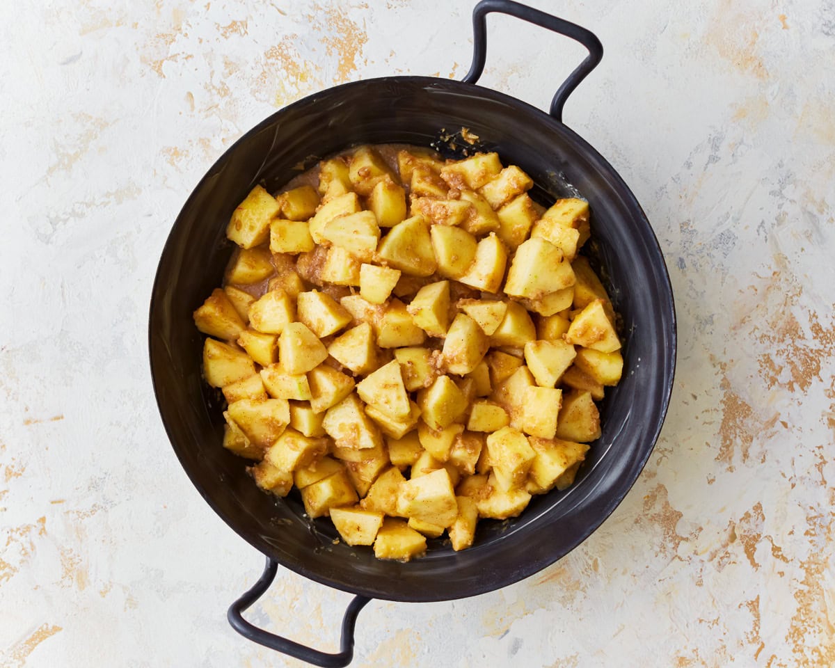 Gluten-free apple crisp filling in a baking dish