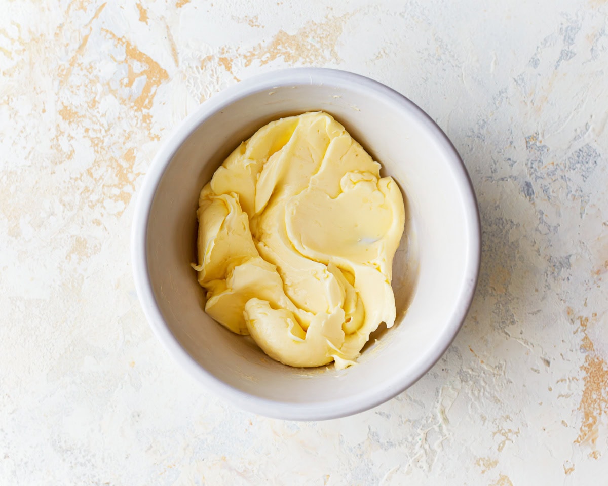 softened butter in a white bowl.