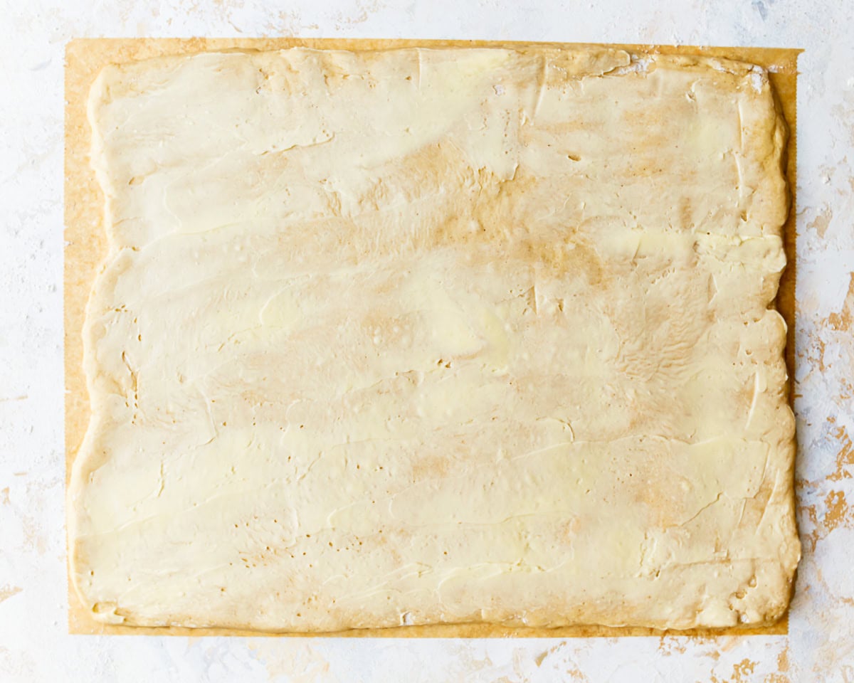 a buttered rectangle of dough.