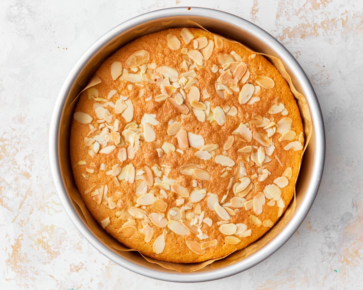 Freshly baked almond flour cake in a baking tin.