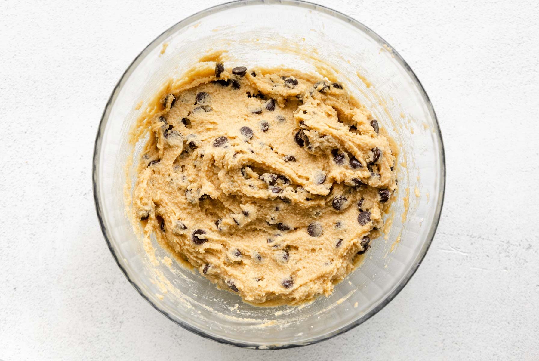 almond flour chocolate chip cookie dough in a glass bowl.