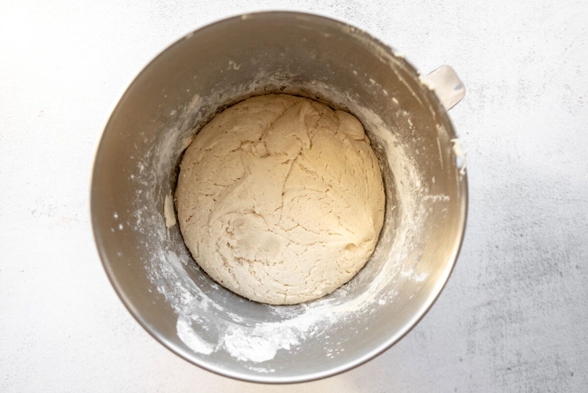 gluten-free english muffin dough in a stand mixer bowl.
