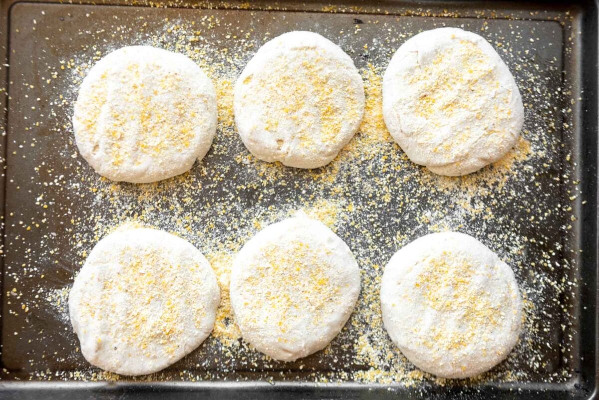gluten-free english muffins dusted with cornmeal.