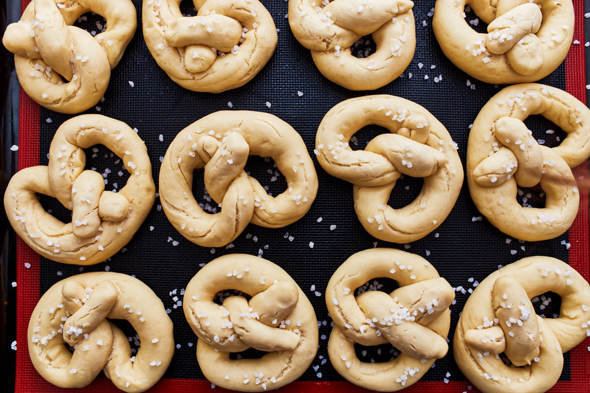 gluten free soft pretzels shaped on a baking sheet.