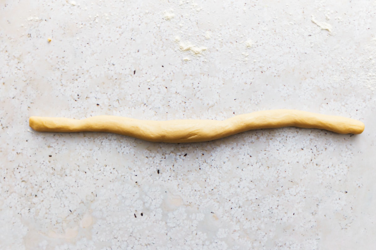 gluten free soft pretzel dough in a long rope.