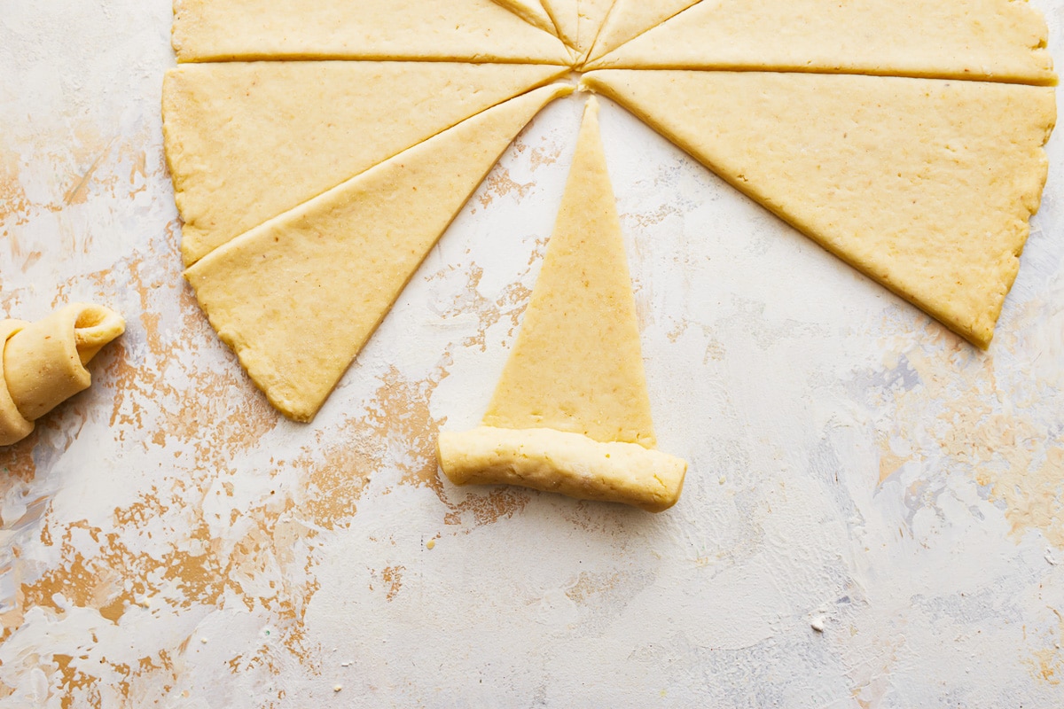 gluten-free crescent roll triangle being rolled up.
