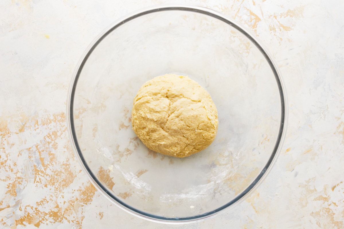 gluten-free crescent roll dough in a glass bowl.