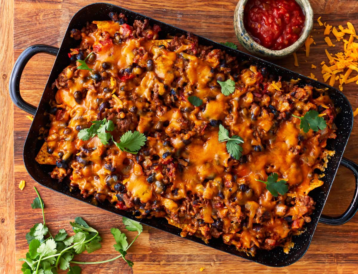 overhead view of walking taco casserole in a baking dish.