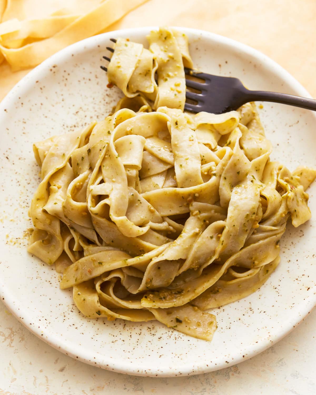 a serving of cooked gluten-free pasta in a bowl with a fork.