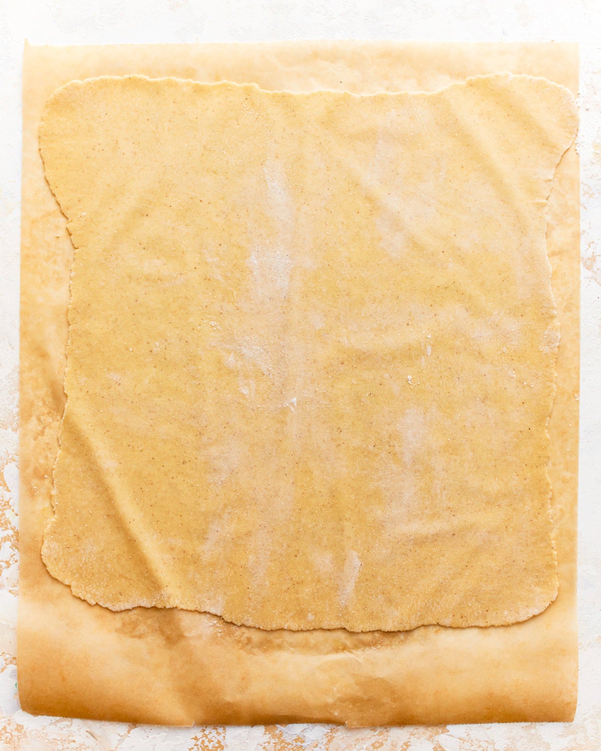 a rolled-out sheet of gluten-free pasta dough.
