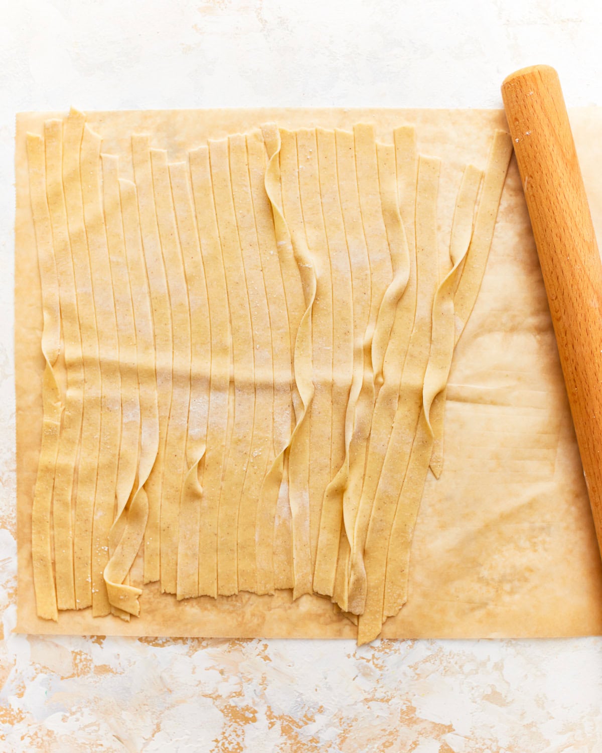 gluten-free pasta dough cut into strips.