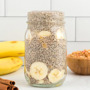 side view of banana chia pudding in a mason jar.