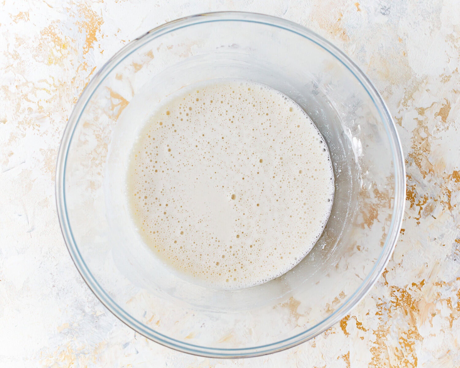 Overhead view of gluten free tempura batter in a mixing bowl.