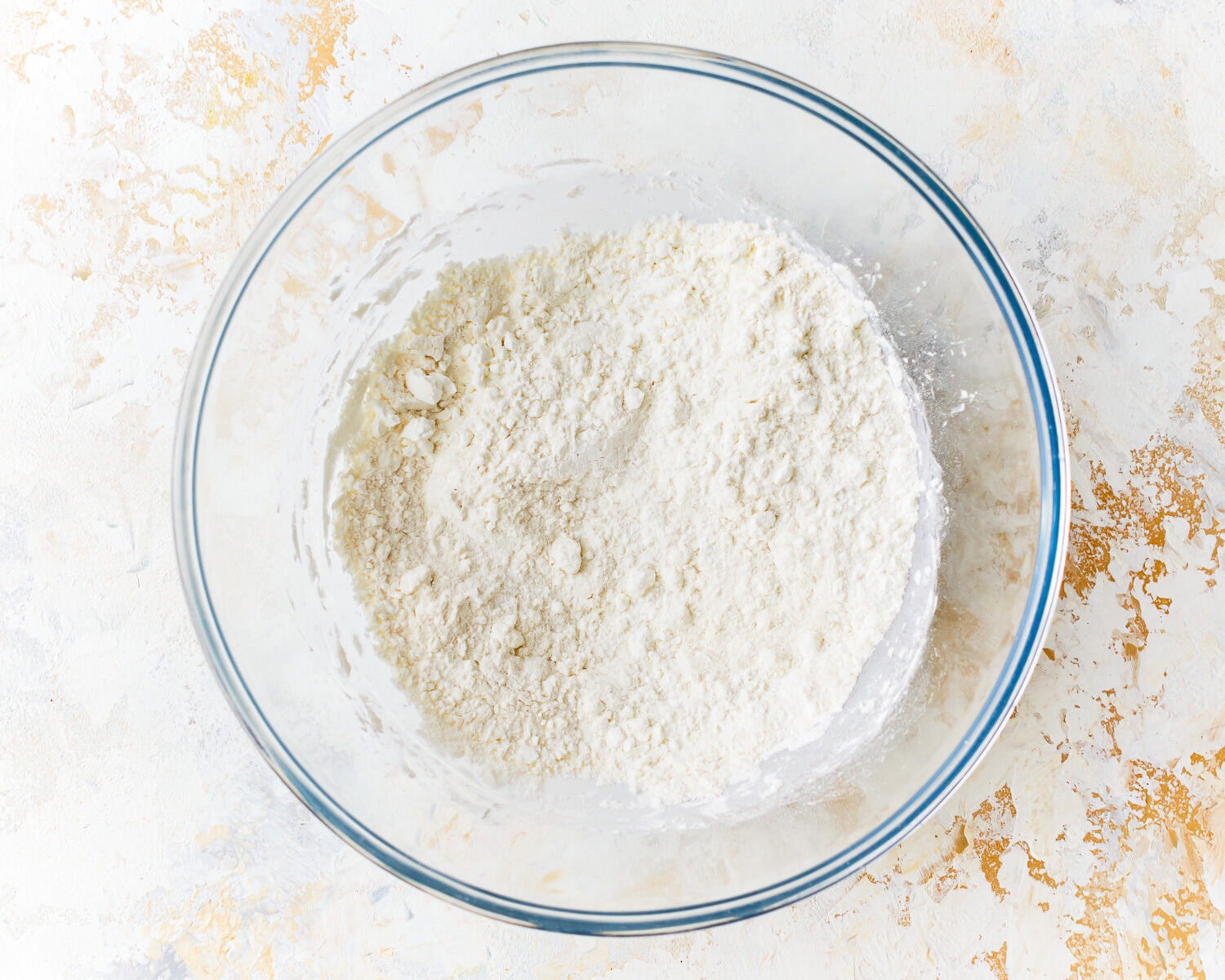 The dry ingredients for gluten free tempura batter in a mixing bowl.