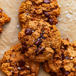 Close up of a stack of gluten-free peanut butter oatmeal cookies sprinkled with sea salt