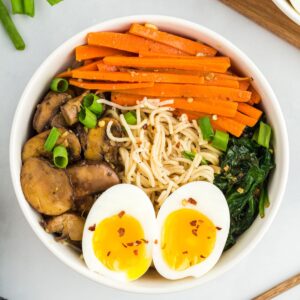 Gluten-free ramen in a bowl with eggs and vegetables