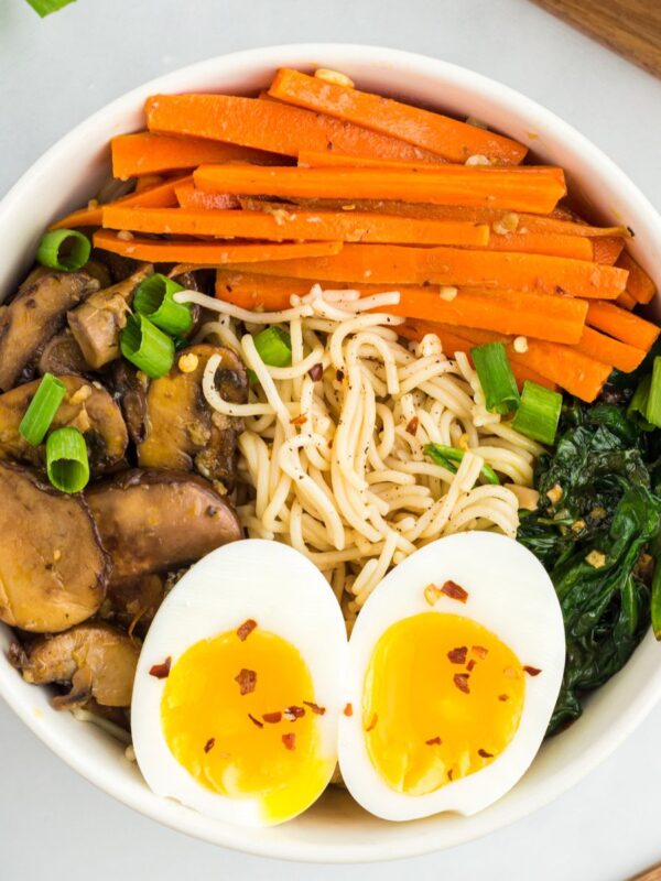 Gluten-free ramen in a bowl with eggs and vegetables