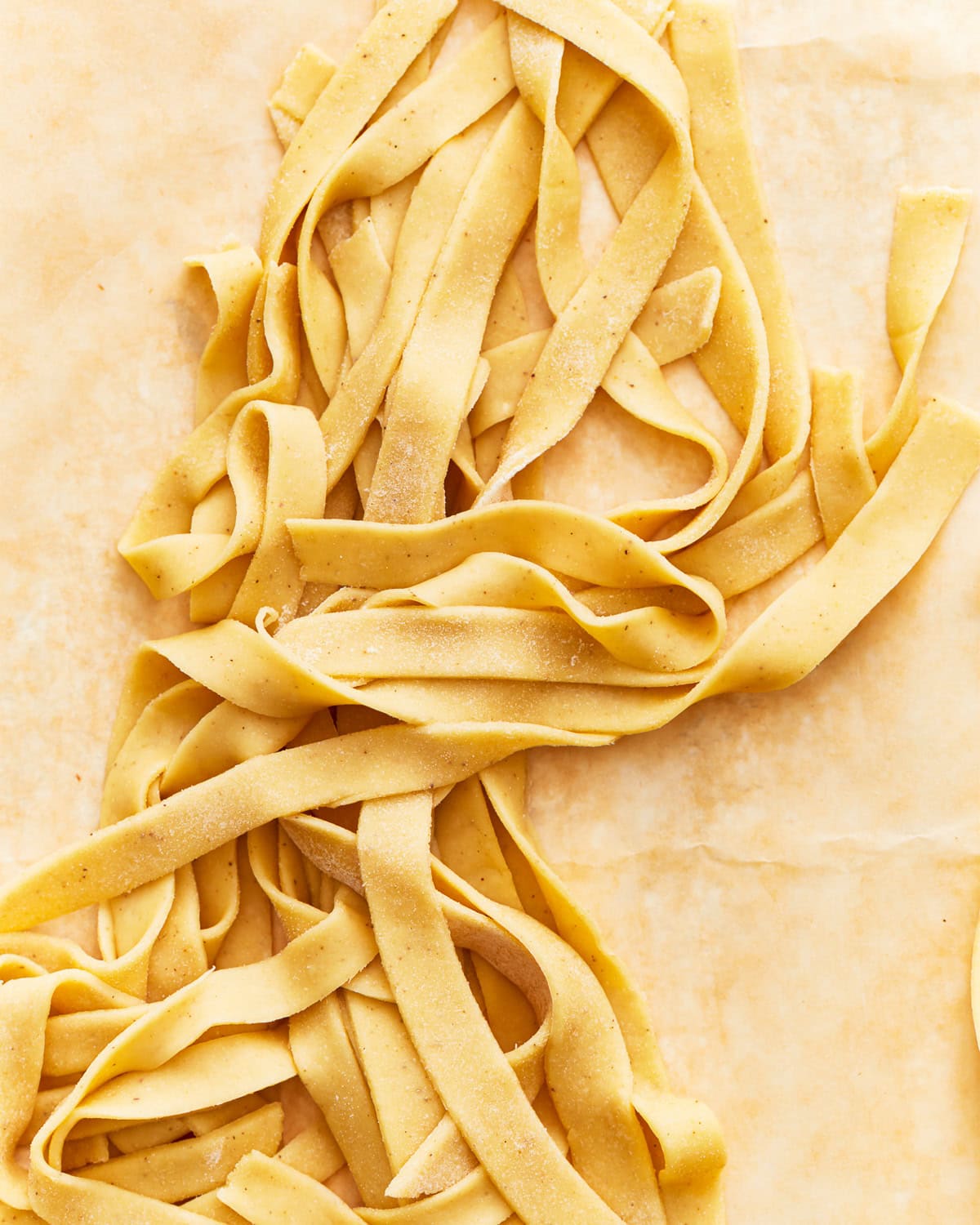 Gluten-free egg noodles on parchment paper