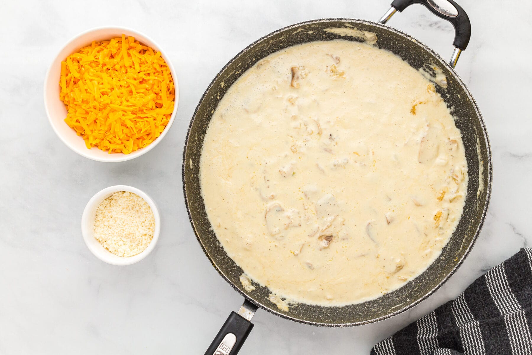 Thickened creamy sauce for gluten-free tuna casserole in a skillet