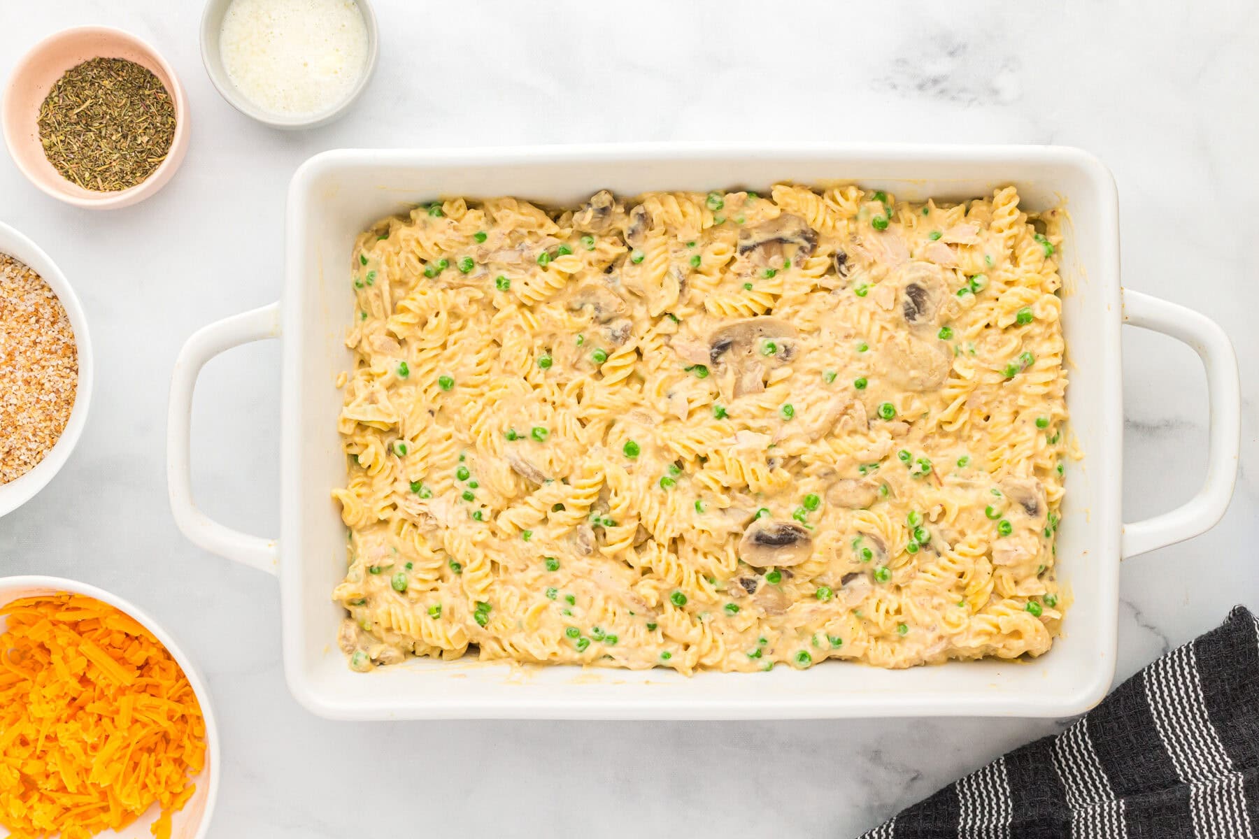 Noodles and sauce in a baking dish for gluten-free casserole