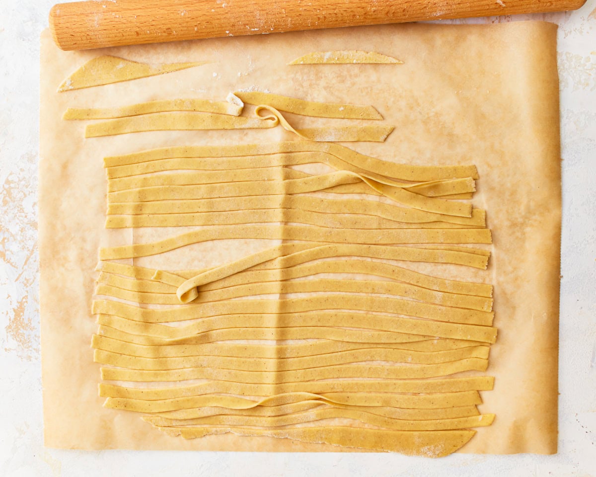 Gluten-free egg noodle dough cut into strips