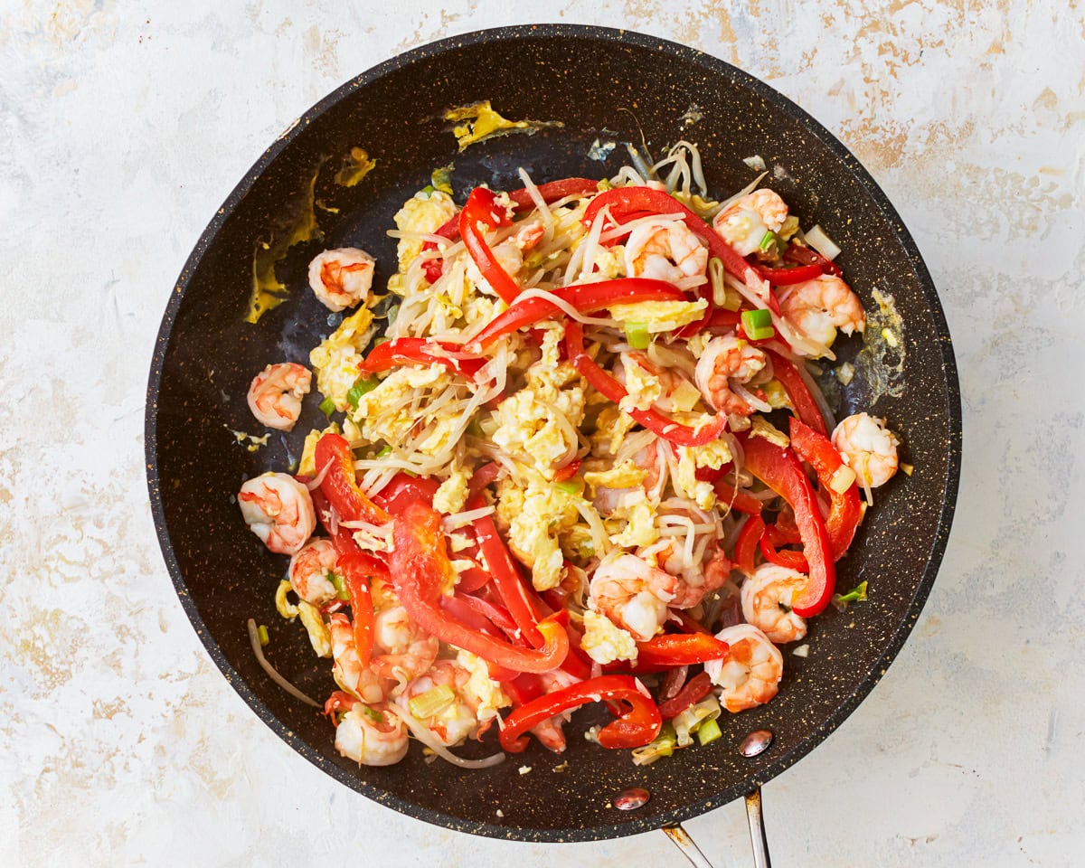 Eggs mixed with vegetables and shrimp for gluten-free pad thai