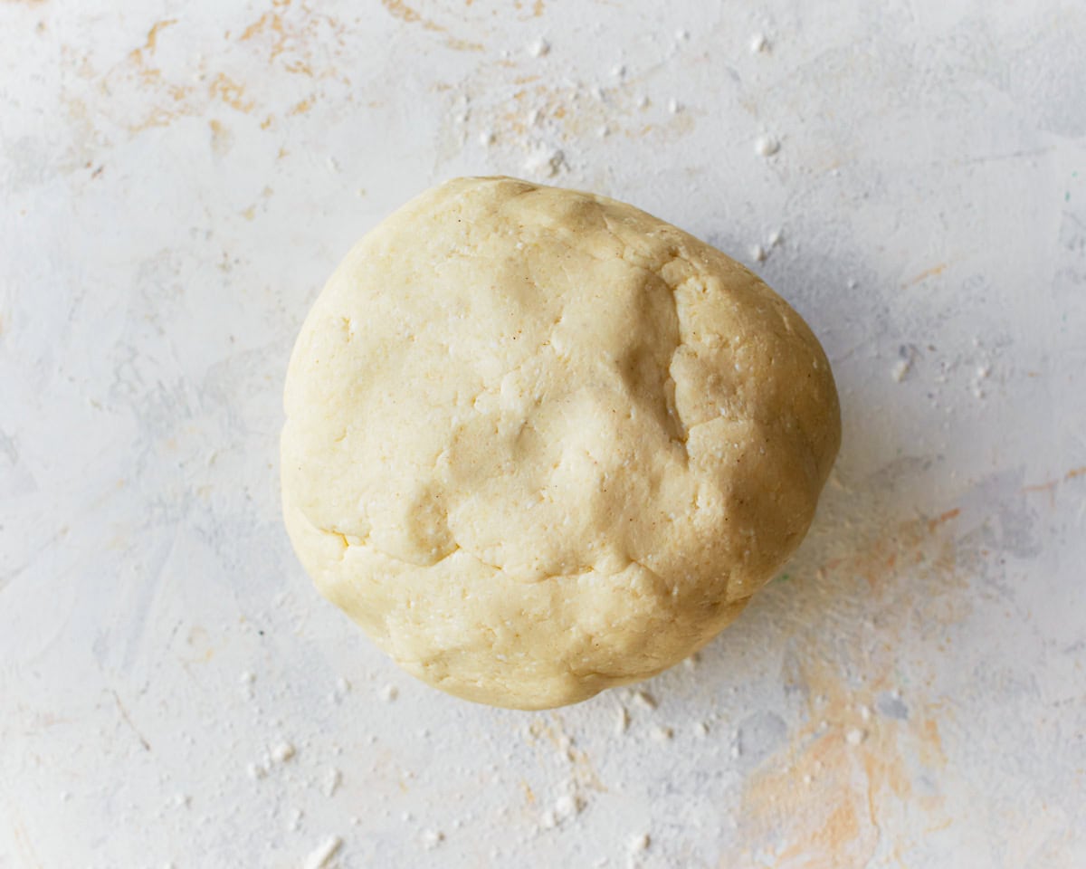 Pandebono bread dough on a floured surface