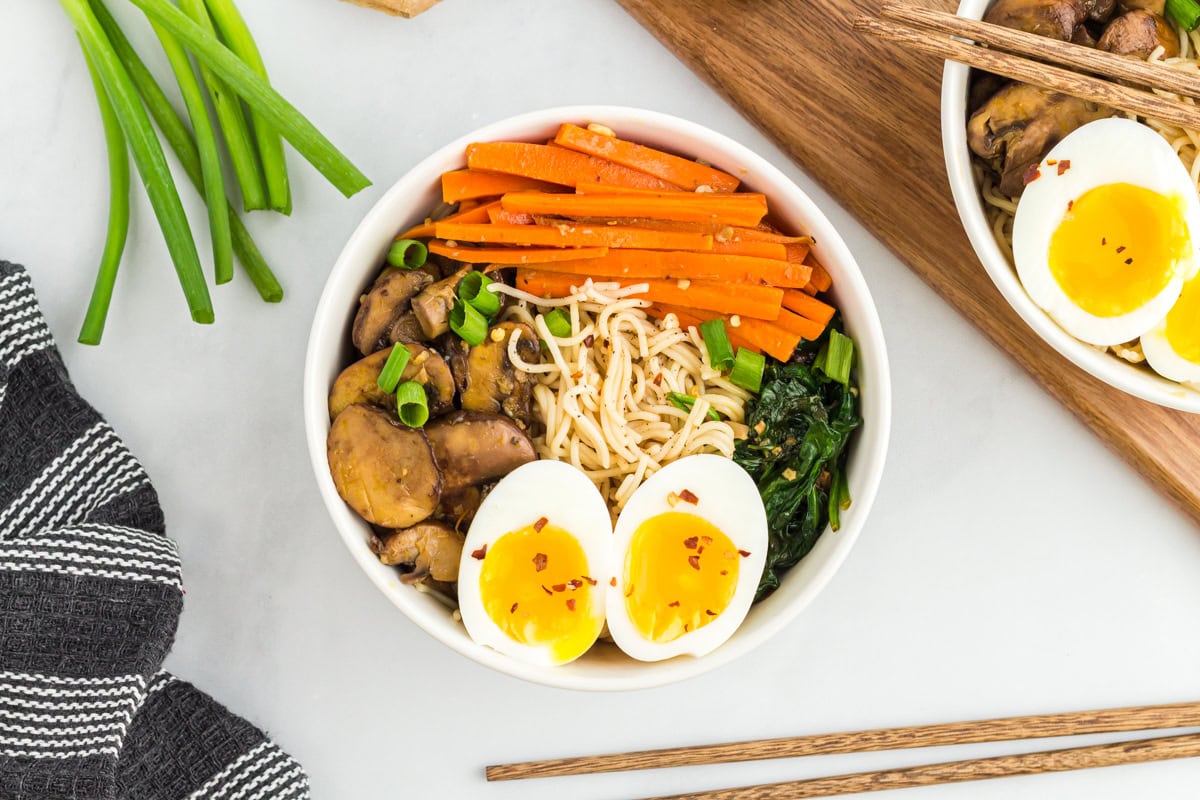 Gluten-free ramen topped with eggs and vegetables