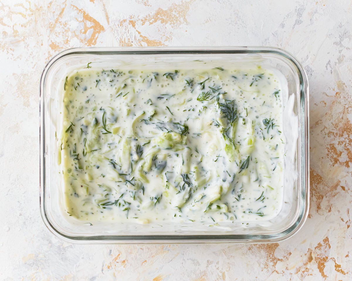 Dairy-free tzatziki in a glass dish