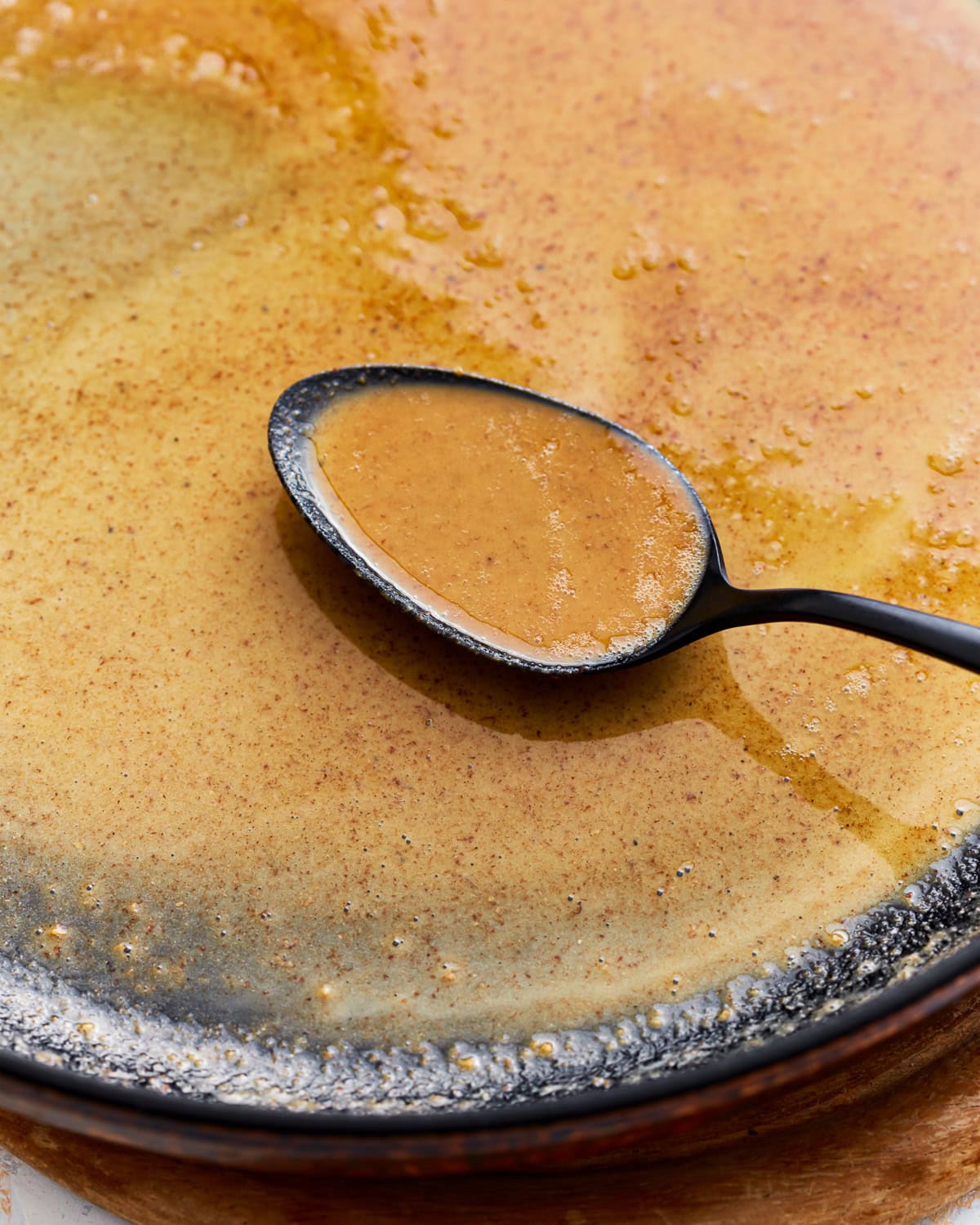 Gluten-free roux in a skillet with a spoon.