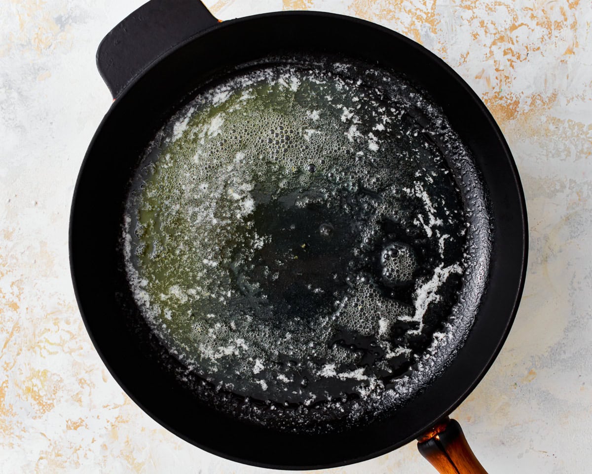 Melted butter in a skillet.