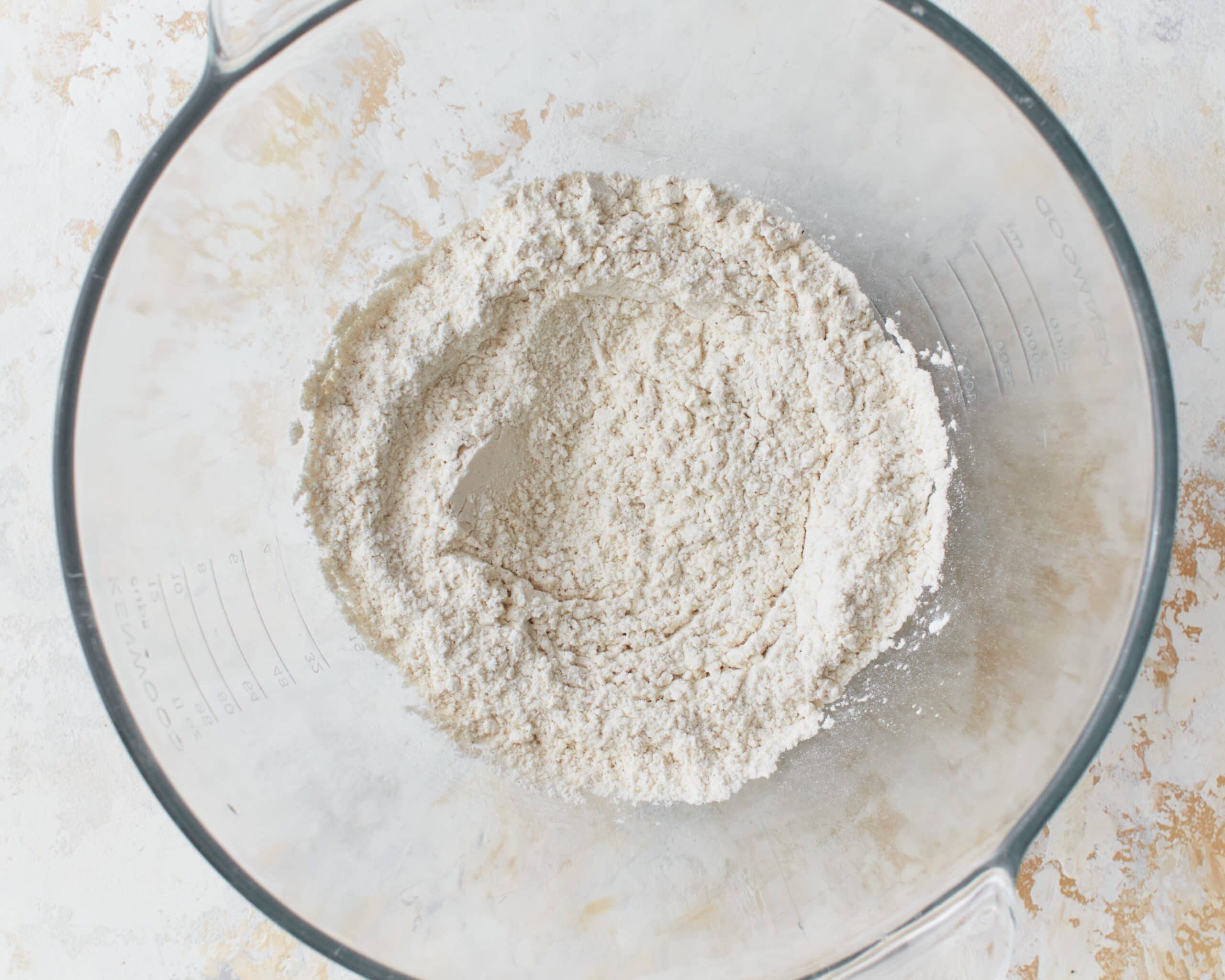 Dry ingredients for gluten-free phyllo dough in a glass mixing bowl.