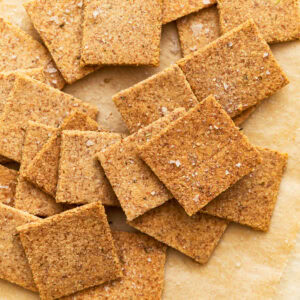 Almond flour crackers on parchment paper.