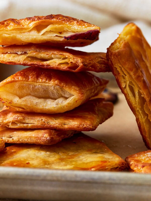 Side view of gluten-free puff pastry squares stacked on top of each other.