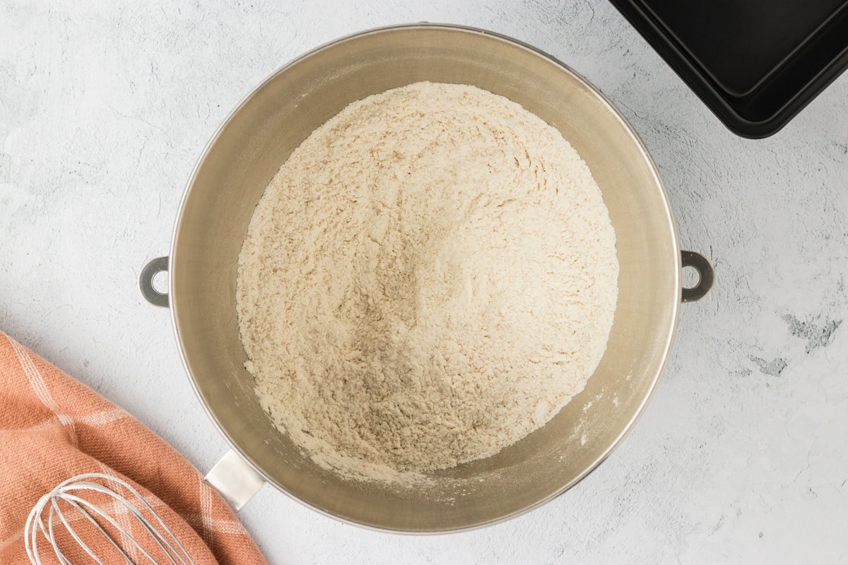 Dry ingredients for gluten-free brioche in a mixing bowl.