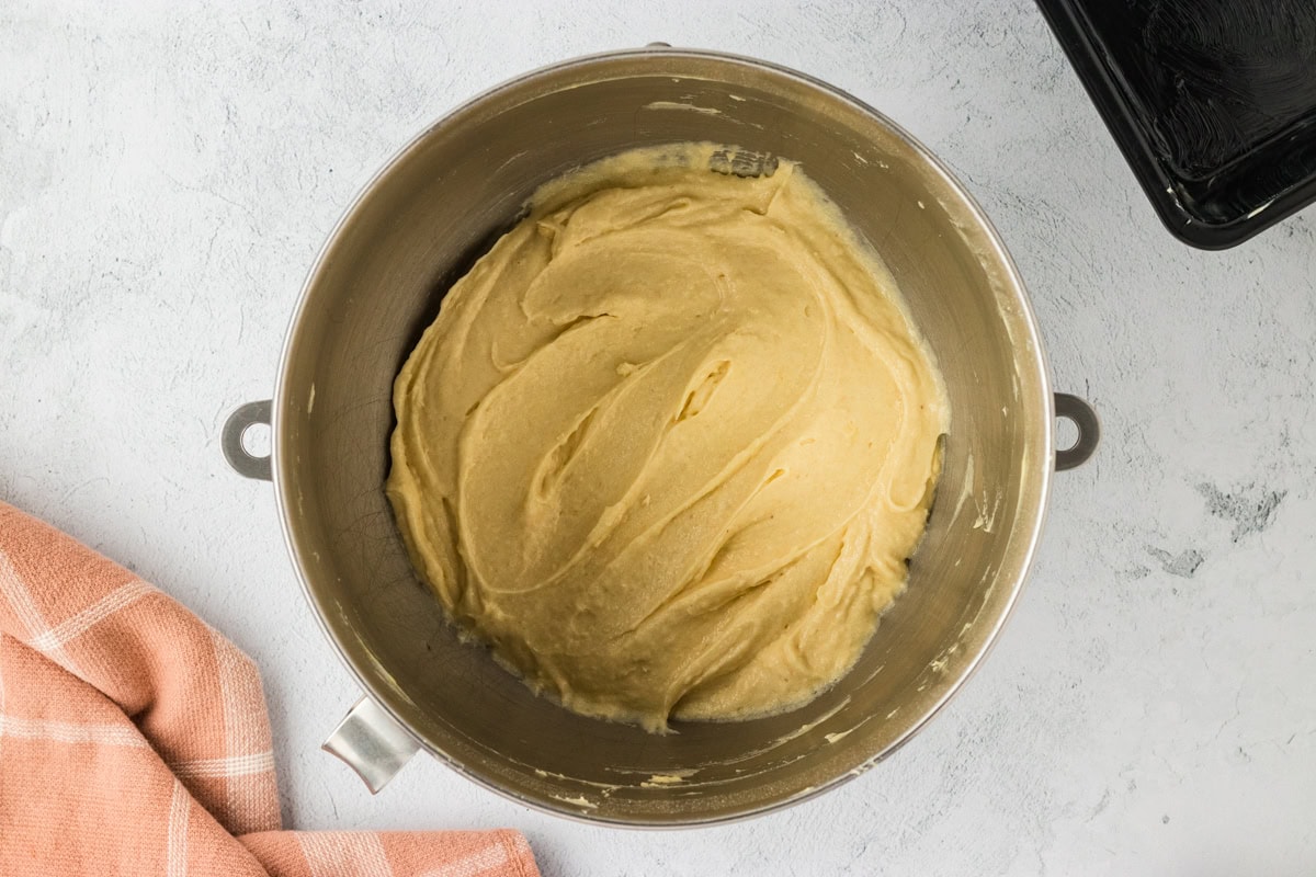 Gluten-free brioche batter mixed until smooth in a mixing bowl.