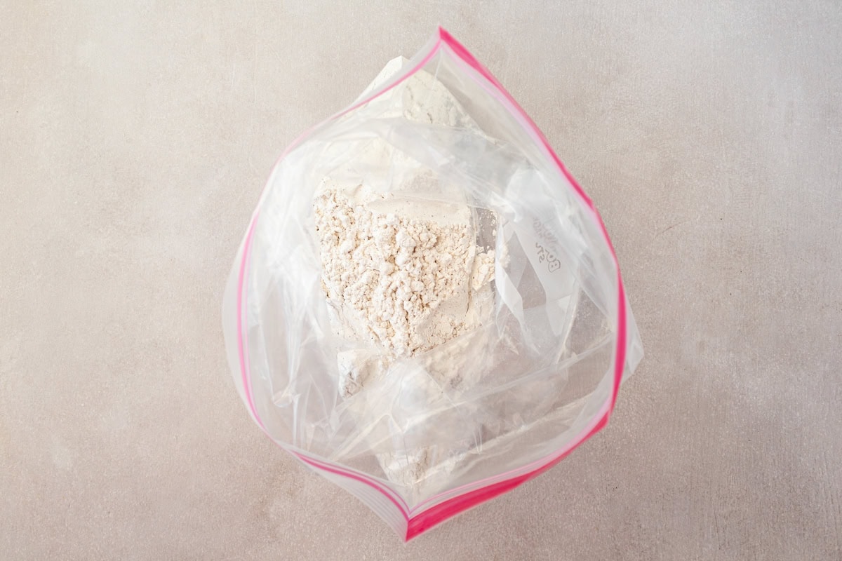 Dry ingredients for gluten-free fried onions in a zip top bag.