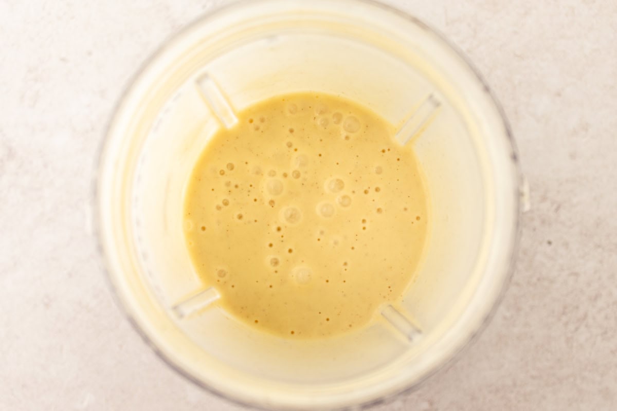 Wet ingredients for gluten-free popovers in a blender.